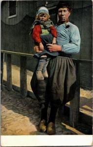 Dutch Man Holding Child, Pipe Vintage Postcard M15