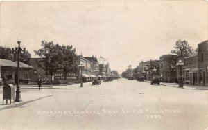 J17/ Little Falls Minnesota RPPC Postcard c1920s Broadway Stores Autos  52