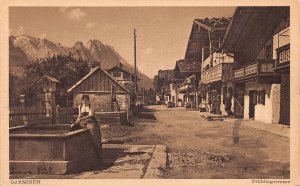 Germany Garmisch Fruehlingstrasse Woman Water Pot Well Street vintage postcard
