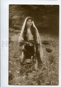 3076857 ROMANIA girl in native dress Vintage real photo PC