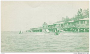 Couples on motor boat in Lake Marion, Rondette Cabins, Santee State Park, Sou...