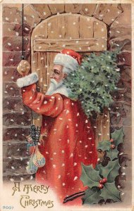 Christmas Greetings Santa Claus in Red Robe Ringing Doorbell Postcard JJ658986