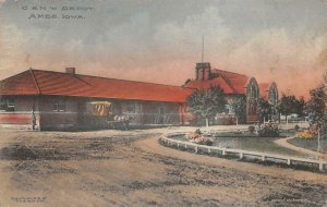 C. & N.W. TRAIN DEPOT AMES IOWA HAND COLORED POSTCARD (c. 1910)