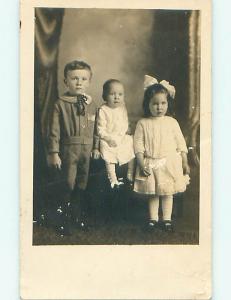 Surface Wear Pre-1918 rppc CUTE GIRL WITH BOW IN HAIR & SIBLINGS r5932