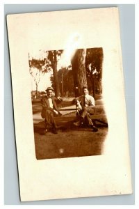 Vintage 1910's RPPC Postcard Photo of Two Men and a Dog on a Park Bench