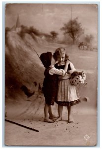 1914 Children Kissing Cheek Barefoot Chicken Hen Antique RPPC Photo Postcard