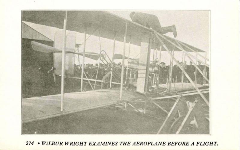 Wilbur Wright examines the Aeroplane before flight (1950's Repro)