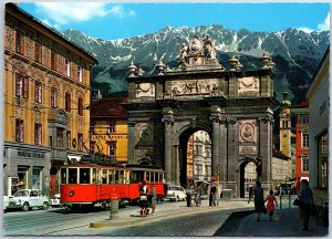 VINTAGE CONTINENTAL SIZED POSTCARD ARC OF TRIUMPH STREET SCENE INNSBRUCK AUSTRIA