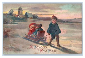 C. 1910 Adorable Kids Sled Winter Snow New Year Greetings Vintage Postcard P219