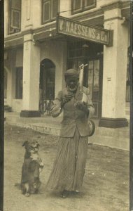 indonesia, SUMATRA MEDAN, Busking Man with Dog, Naessens (1910s) RPPC Postcard