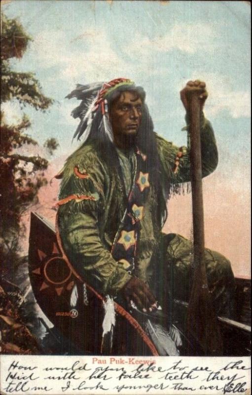 Native Americana Indian Pau Puk-Keewis in Canoe w/ Paddle Postcard c1910