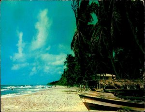 CI01344 trinidad tobago mayaro beach boats palmtrees caribbean sea