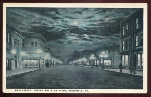 h1096 - BOONVILLE Missouri Postcard 1920s Main Street at Night. Stores