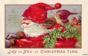 SANTA CLAUS EMBOSSED SPEEDING THROUGH SNOW WITH ELF