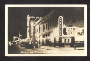 RPPC RENO NEVADA DOWNTOWN STREET SCENE AT NIGHT OLD CARS REAL PHOTO POSTCARD