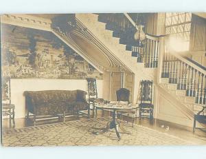 Pre-1930 rppc ANTIQUE COUCH UNDER THE STAIRWELL PLUS OLD TABLE AND CHAIRS HM0359