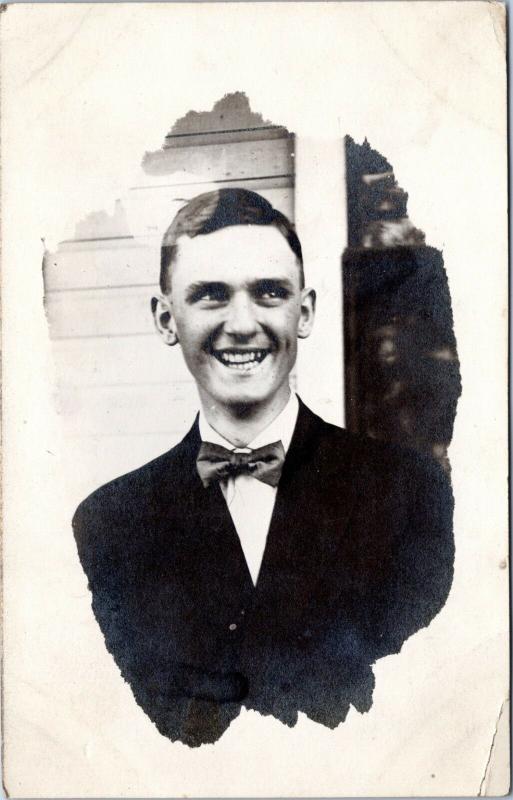 RPPC: Very smiley guy in a bow tie - posted 1912, Avon Iowa