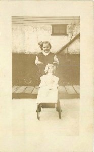 C-1910 Girl large doll Stroller Residence RPPC Photo Postcard 21-11792