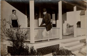 Edwardian Era Man Woman on Porch Message about Camera Real Photo Postcard V12