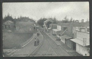 CA 1909 PPC* TRAIN TRACK IN BETWEEN HOMES RUBBER NECK ROW IN WINTER SEE INFO