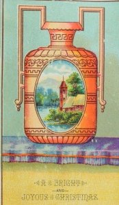 1880's-90's Victorian Christmas Trade Card Beautiful Urn Lake Scene P62