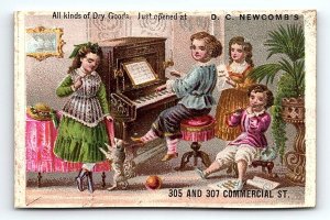 c1880 D.C. NEWCOMB DRY GOODS YOUNG PIANIST VICTORIAN TRADE CARD Z1110