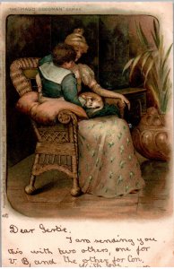 Mother with son and cat in lap - Tuck Postcard - in 1902