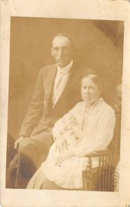 1920s RPPC Real Photo Postcard Mosely Family Father Mother Holding Baby