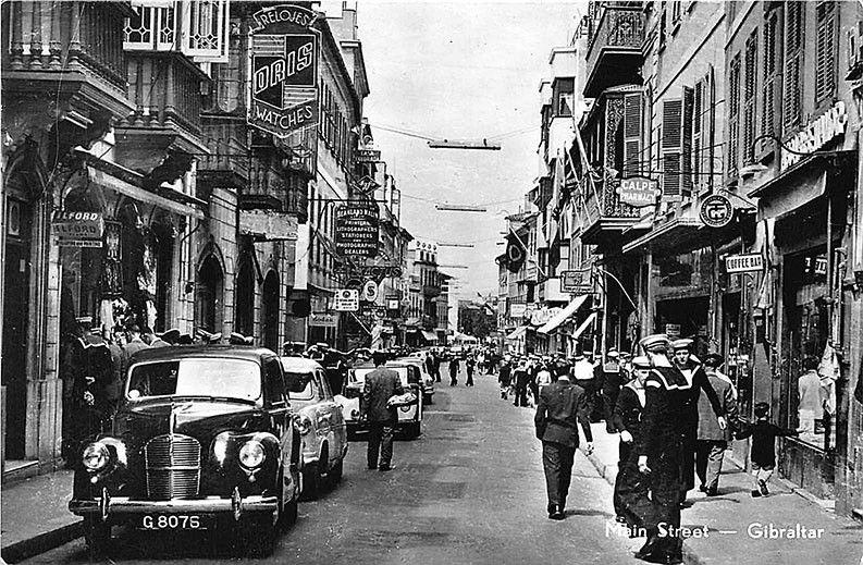 Gibraltar Main Street Store fronts Sailors Old Cars Real Photo RPPC Postcard