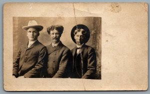 Postcard RPPC c1905 Studio Photo Of 3 Men Hats Hairstyle