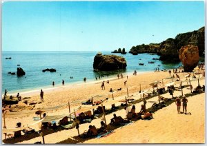 VINTAGE CONTINENTAL SIZE POSTCARD BATHING SCENE AT LAGOD ON THE ALGARVE PORTUGAL