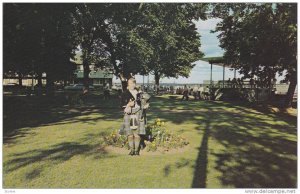 A Charming Highland Lassie Plays The Bagpipes For Visitors To Tidal Bore Park...