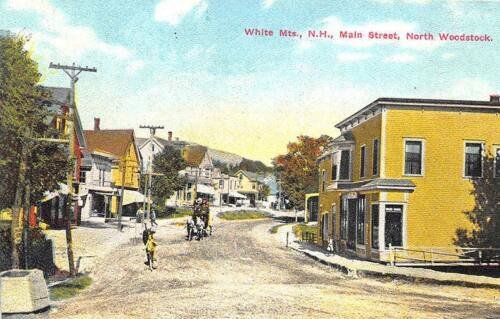 North Woodstock NH Main Street Storefronts Stage Coach Postcard 