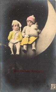 RPPC Hand-Colored Children on Paper Moon w/ Bag of Money, German Happy New Year