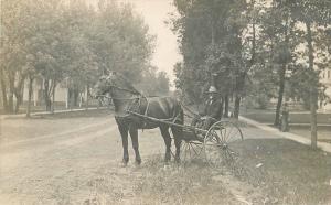 C-1910 Man two wheel horse Buggy Street Scene RPPC Real photo postcard 2184