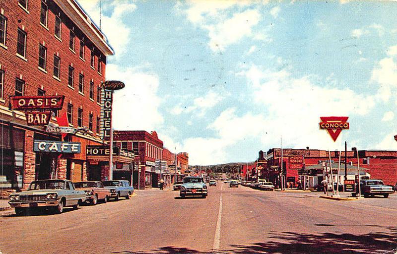 Lusk WY Storefronts Oasis Bar Conoco Gas Station Old Cars Postcard