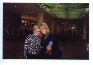 498384 Russia 1997 singer Bonnie Tyler with matryoshka concert in Moscow photo