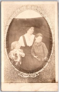 Mother and Children in Oval Photograph with Flower Border Postcard