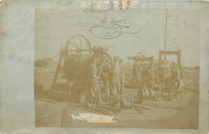 WWI RPPC Postcard Hungarian Soldiers Around Heavy Machine Railroad Train Parts