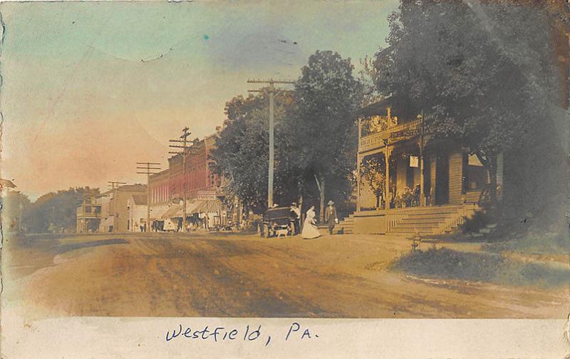 Westfield PA 1906 Dirt Street View Store Fronts Tinted RPPC Postcard