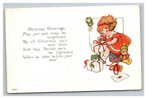 Vintage 1927 Christmas Postcard Cute Girl Opening Up Presents on Xmas Morning