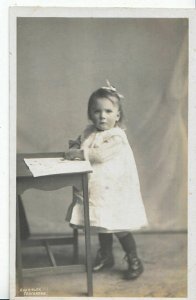 Children Postcard - Small Girl Stood Up and Writing On A Table   U267