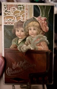 1909 Embossed Christmas Postcard Two Cute Little Girls Church Pew W/ Ribbon JA9