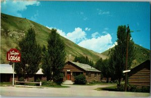 View of Cabins at Utopia Lodge, Jackson WY Highways 26 89 187 Vtg Postcard C57