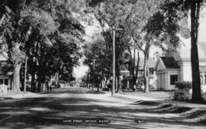 Orono, Maine - Looking down tree-lined Main Street - c1940