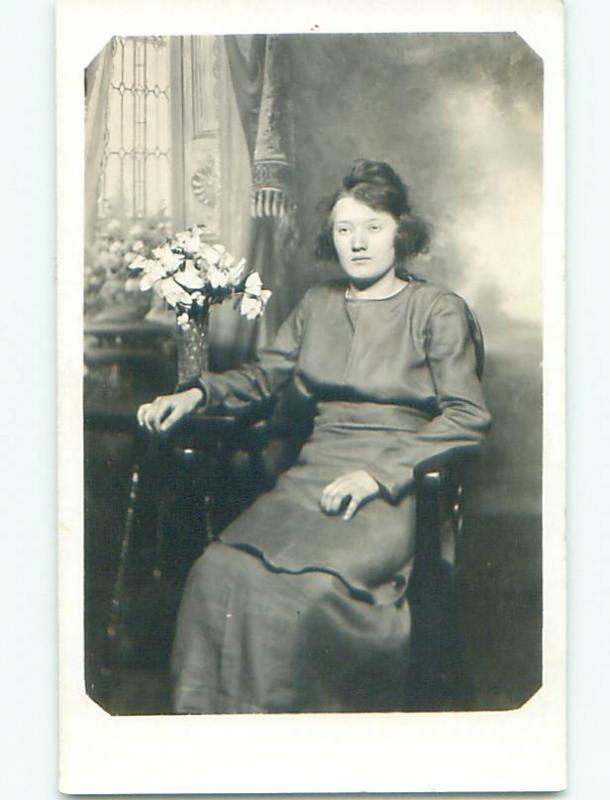 Pre-1930 rppc WOMAN WITH SHORT HAIR BY THE FLOWER VASE o2080