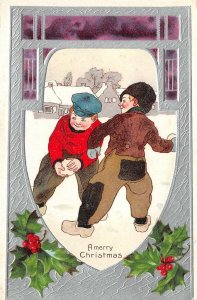 A Merry Christmas Boys Throwing Snowballs ca 1910s Vintage Embossed Postcard