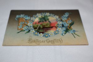 Birthday Greetings Blue Flowers Landscape Scene Embossed Postcard