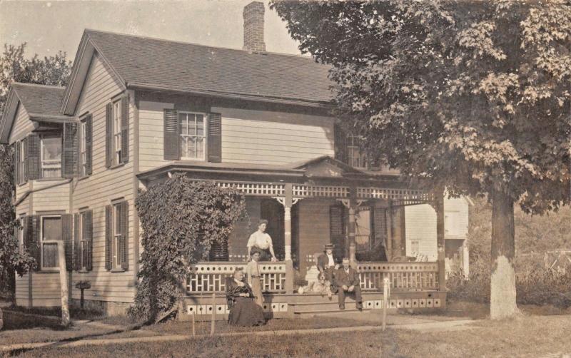 WOMEN & MEN SITTING ON VICTORIAN PORCH-PERIOD CLOTHING-REAL PHOTO POSTCARD 1910s