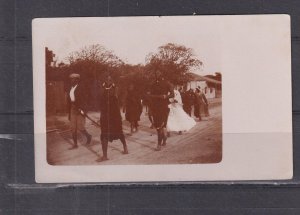 SOUTH AFRICA, NATIVE WEDDING PARTY WALKING ALONG STREET, c1920 real photo ppc.